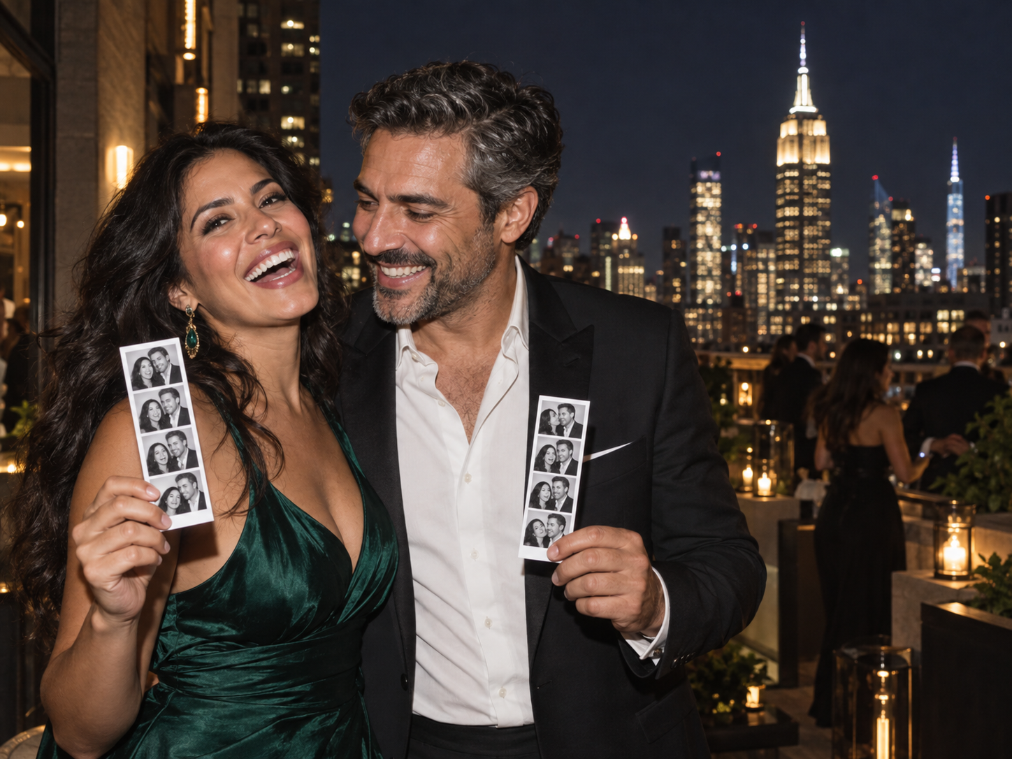 Guests with Photomania photo strips at Manhattan rooftop event